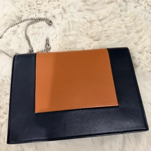 Black Grommet Leather Top-Handle Bag